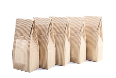 Row of boxes from the goffered cardboard on a white background clipart