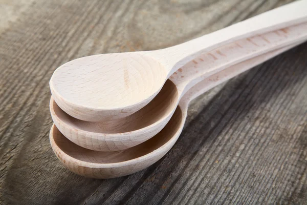 New wooden spoon on table — Stock Photo, Image