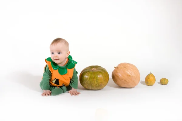 Baby in a Halloween pumpkin costume — Stock Photo, Image