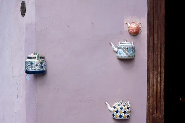 Teapots on wall — Stock Photo, Image