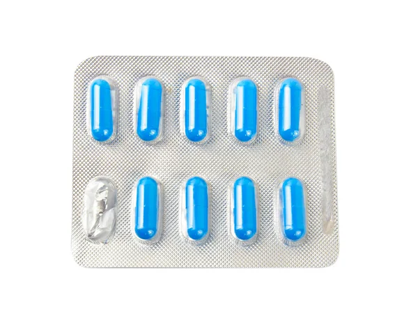 Package with blue tablets — Stock Photo, Image