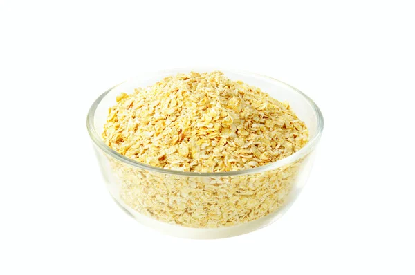 Dry oat grains in the glass bowl — Stock Photo, Image