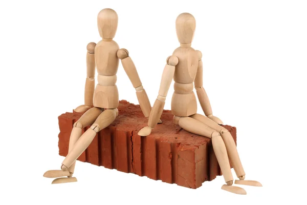 Two dummy and red brick — Stock Photo, Image