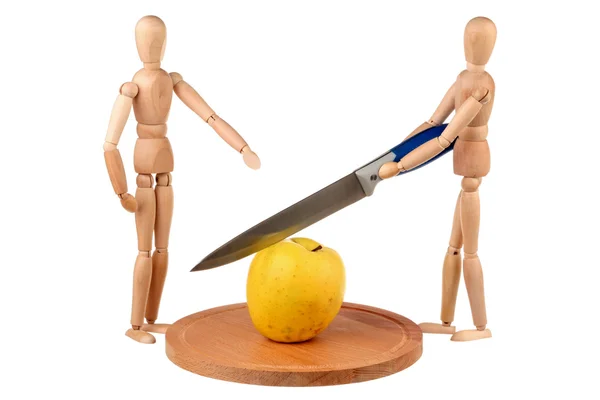 Two dummy divide one apple — Stock Photo, Image