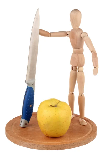 Манекен, нож и яблоко — стоковое фото