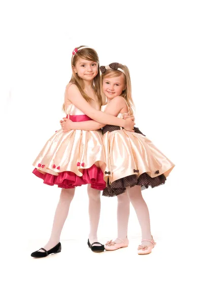 Две привлекательные маленькие девочки в платье — стоковое фото