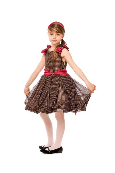 Mooie kleine dame in een bruine jurk — Stockfoto