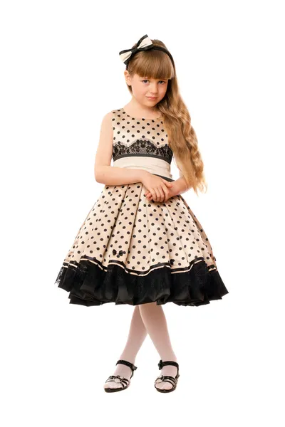Trevlig liten tjej i en klänning — Stockfoto