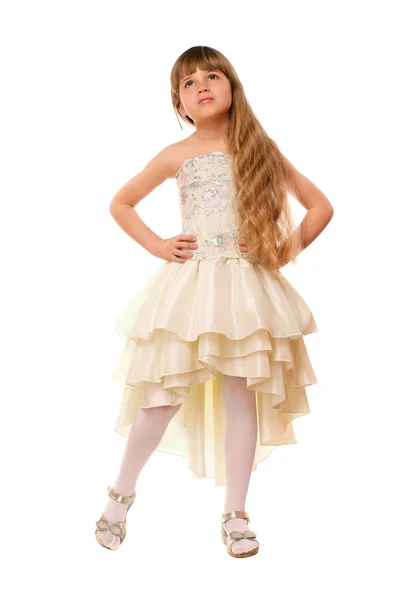 Härlig liten flicka i en beige klänning — Stockfoto