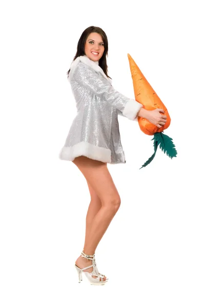 Beautiful young brunette with a carrot — Stock Photo, Image