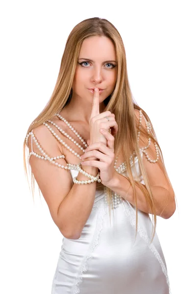 女孩用手指向她的嘴唇 — Stockfoto