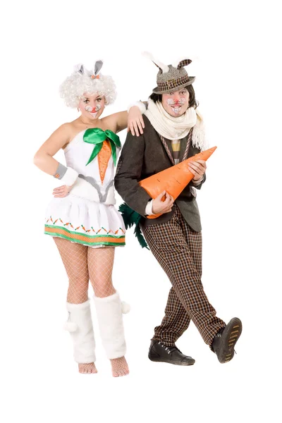 Couple with carrot dressed as rabbits — Stock Photo, Image