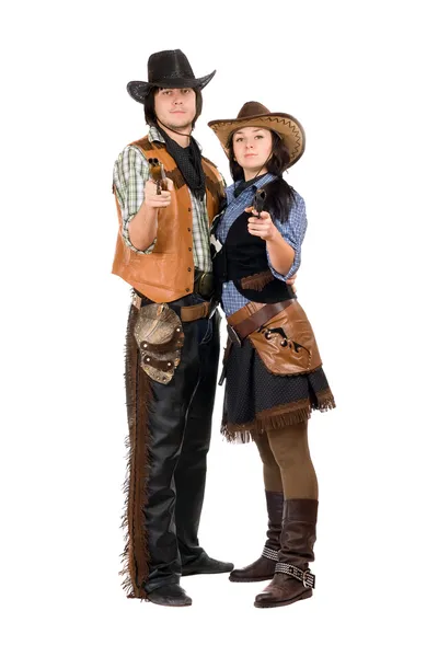 Молодой ковбой и ковбойша с оружием — стоковое фото