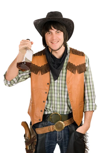 Happy young cowboy with a bottle — Stock Photo, Image