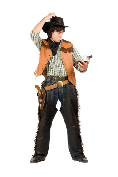 Nachdenklicher junger Cowboy mit Flasche — Stockfoto