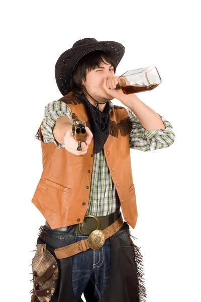 Cowboy drinking whiskey from the bottle — Stock Photo, Image
