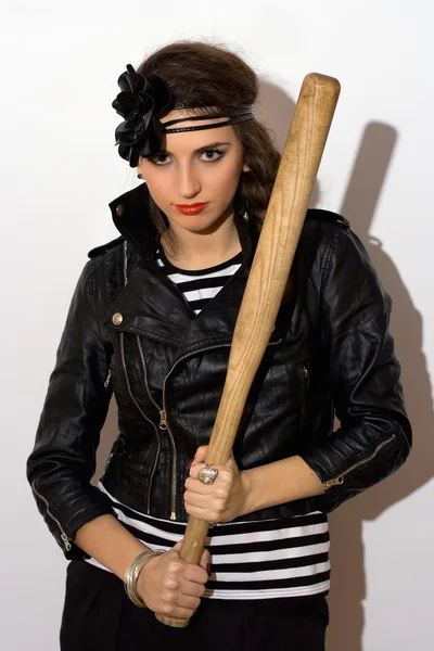 Pretty young woman with a bat — Stock Photo, Image