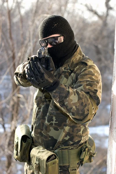 Portrait of soldier with a handgun — Stock Photo, Image