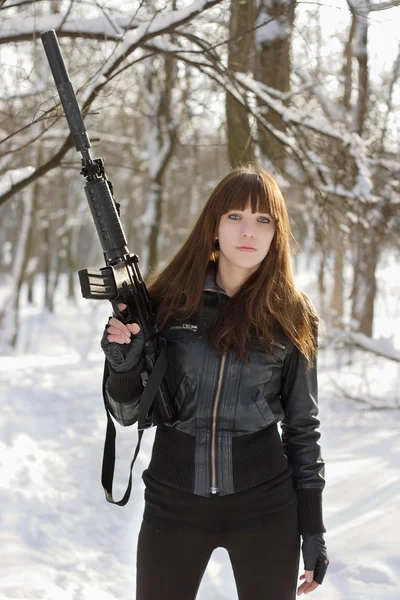 Brunette with the raised rifle — Stock Photo, Image