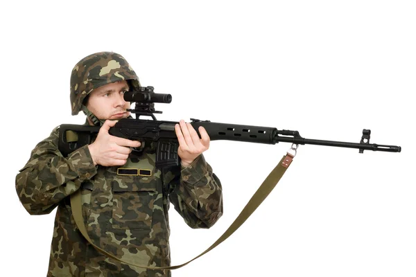 Soldado segurando uma espingarda — Fotografia de Stock