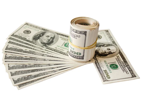 Geld knipsel gerold op een achtergrond met dollars — Stockfoto