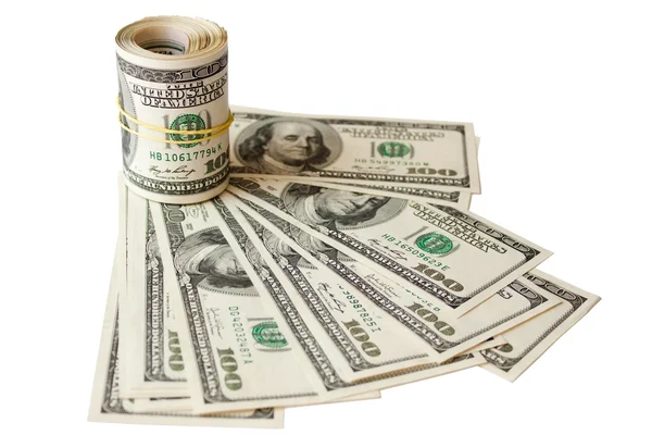 Geld knipsel gerold op een achtergrond met dollars — Stockfoto