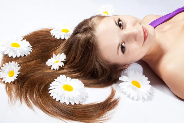 Close-up of a young woman with white flowers — Stock Photo, Image