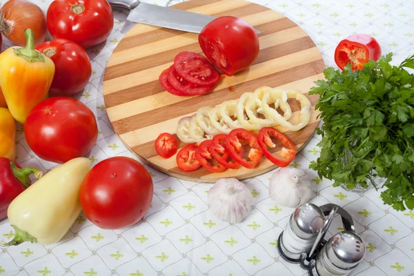 Table with vagatables in kitchen — Stock Photo, Image