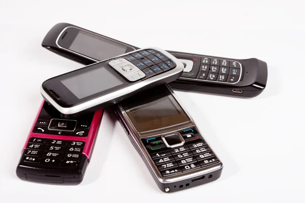 Vier Mobiltelefone. — Stockfoto