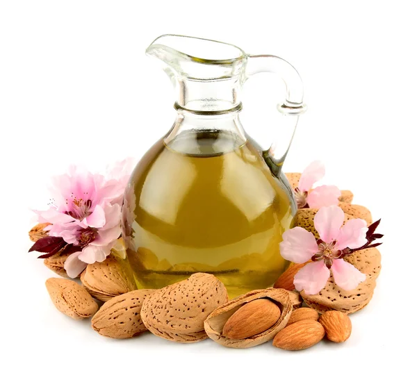 Almond oil and almond nuts — Stock Photo, Image
