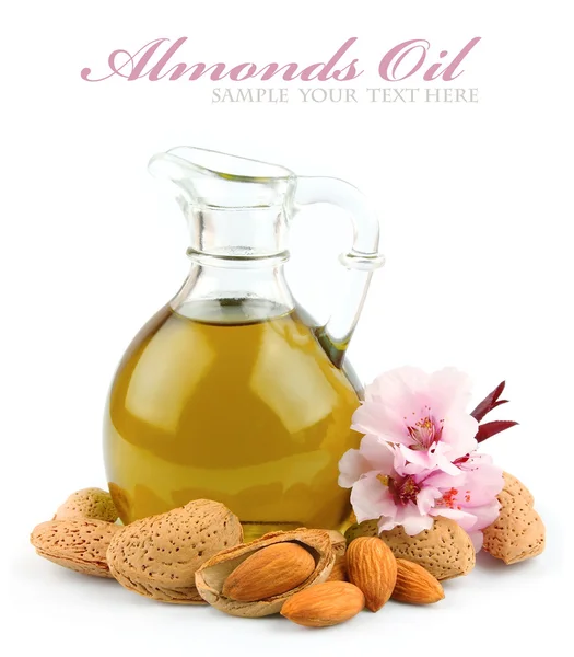 Almond oil with nuts — Stock Photo, Image