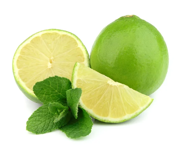 Whole lime and cut with mint — Stok fotoğraf