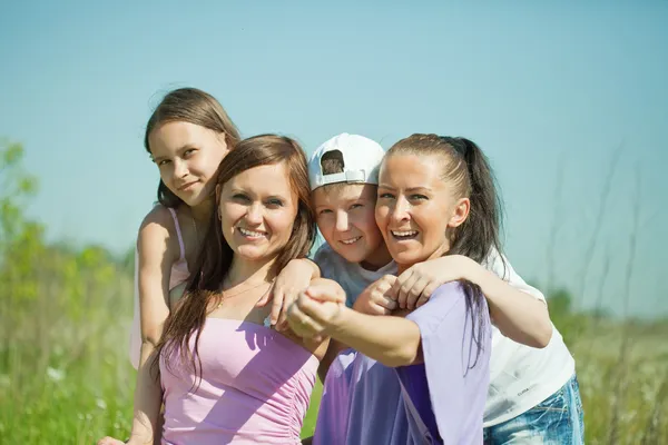 Two happy women with teens — Stock Photo, Image