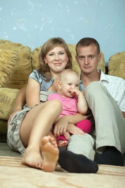 Parents with baby in home interior — Stock Photo, Image