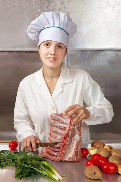 Cook woman cooking meat — Stock Photo, Image