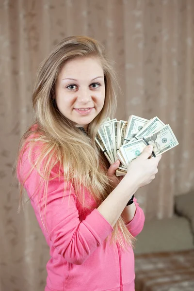Glückliches Mädchen mit Bündeln von uns Dollars — Stockfoto