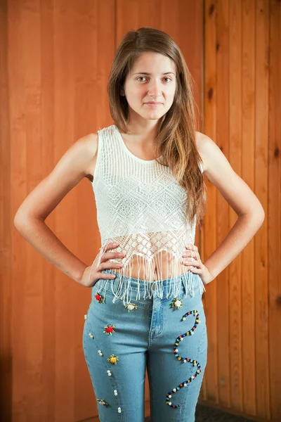 Teen girl shows cloth beaded by herself — Stock Photo, Image