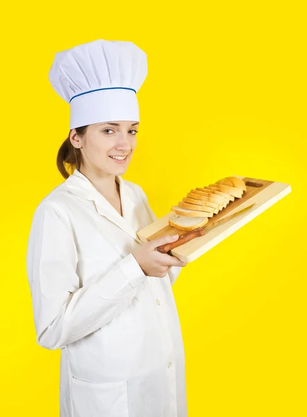 Female chef holding slice bread — Stock Photo, Image