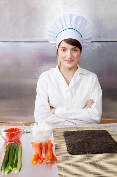 Cook woman with ingredients for sushi rolls — Stock Photo, Image