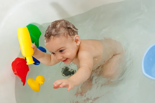 Year-old baby swimming in bath — Stock Photo, Image