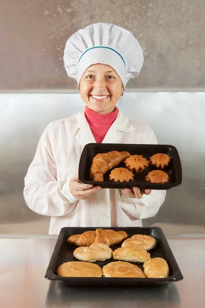 Baker with pastries — Stock Photo, Image