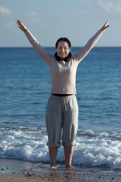 Happy mature woman on sea beach — Stock Photo, Image