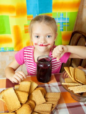 Little girl eating jam clipart