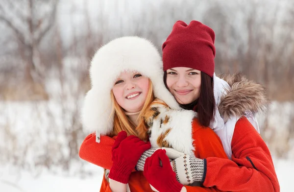 Happy girls in winter park — Stock Photo, Image