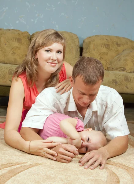 Parents with baby in home — Stock Photo, Image