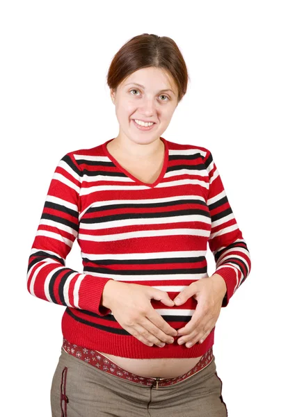 Těhotná žena se srdcem na břiše — Stock fotografie