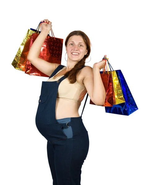 Pregnant woman with shopping bags — Stock Photo, Image