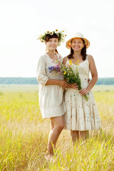 Happy women with flowers — Stock Photo, Image