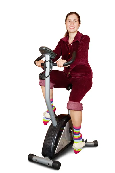 Girl exercise on spinning bicycle — Stock Photo, Image