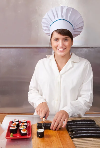 stock image Cook making sushi rolls